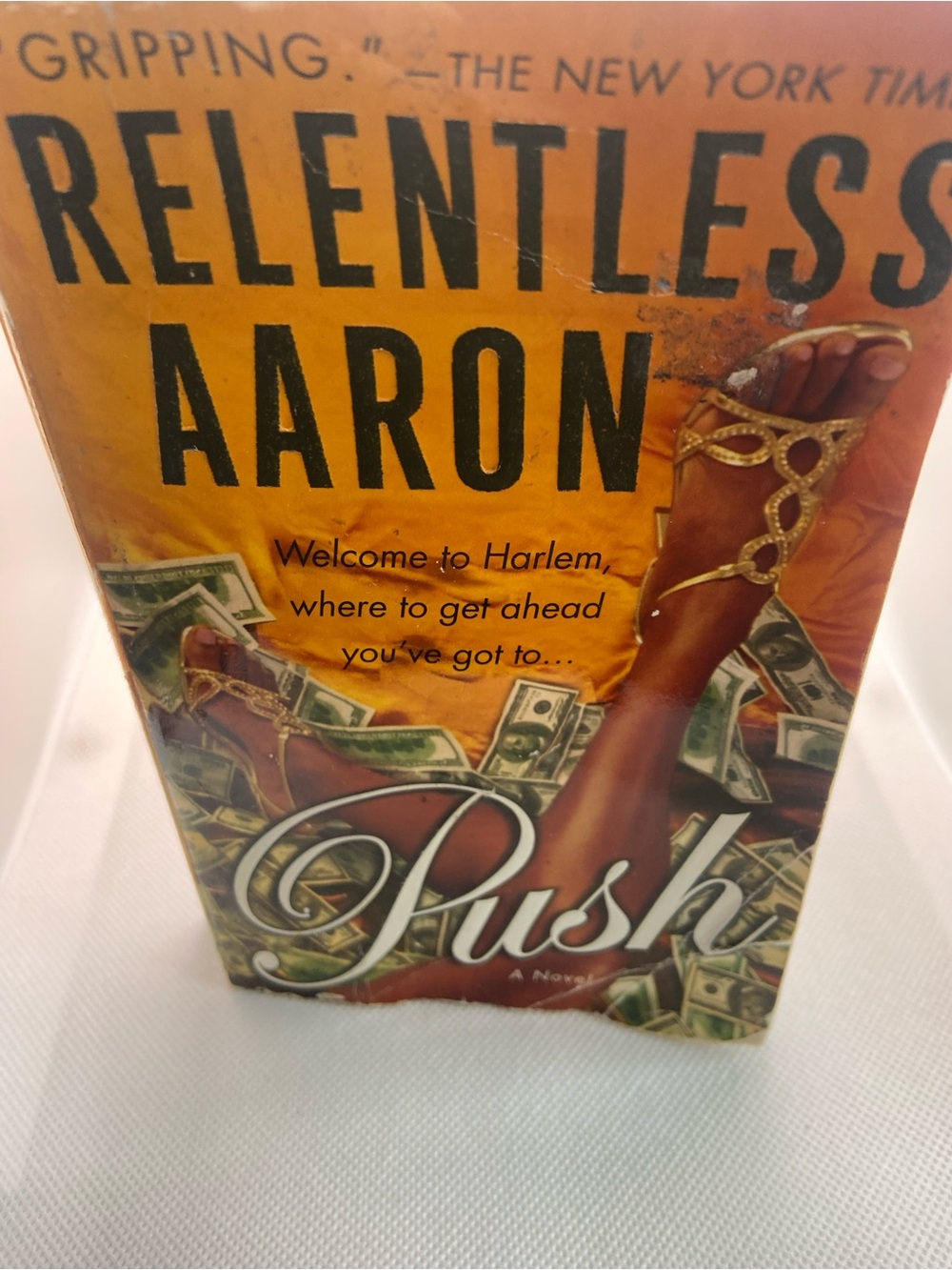 Relentless Aaron "Push" Paperback Book - Orange Cover with Gold Sandals